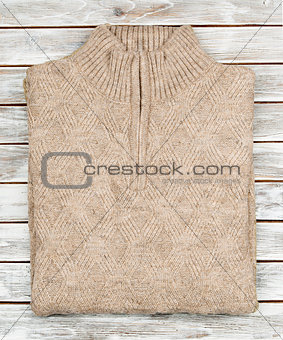 Sweater on wooden background