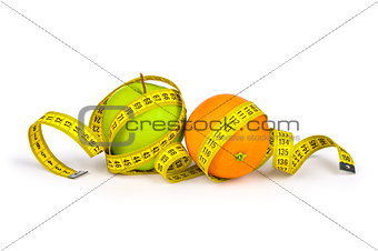 Measuring tape around the orange and green apple. Concept slim f