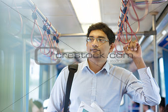 Indian business man inside train.