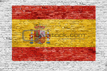 Spanish flag painted on brick wall
