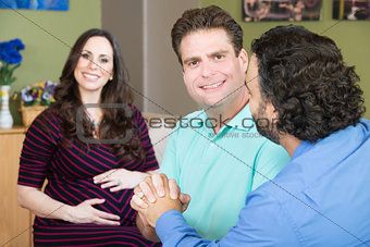 Happy Male Couple with Surrogate Mother