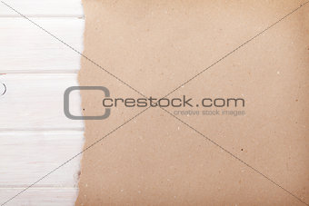 Cardboard paper over white wood background
