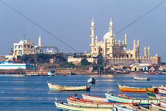 fishing harbour with mosque in the background