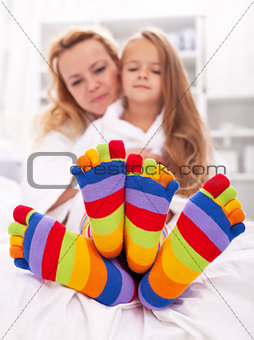 Woman and little girl wearing funny socks