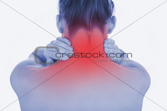 Topless woman massaging her neck
