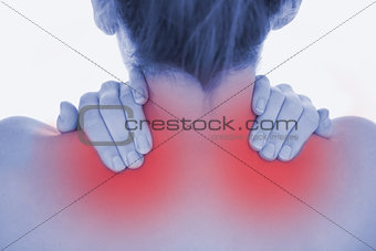Closeup of of woman massaging neck