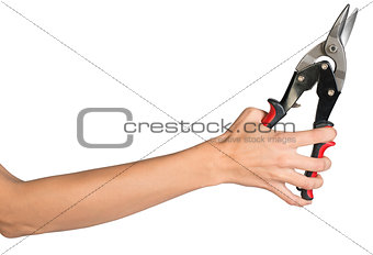 Female hand holding tin snips