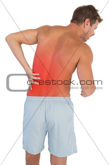 Man with shorts suffering from lower back pain
