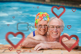 Composite image of happy mature couple in the swimming pool
