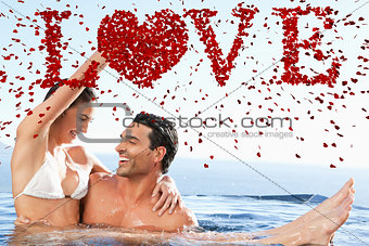 Composite image of happy couple enjoying time together in the pool