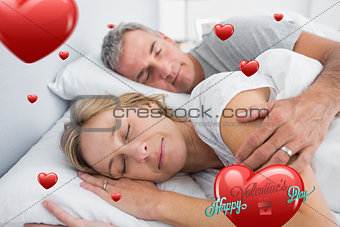 Composite image of couple sleeping and spooning in bed