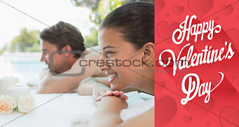 Composite image of couple lying on massage table at spa center