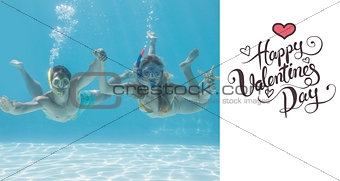 Composite image of cute couple underwater in the swimming pool with snorkel and starfish