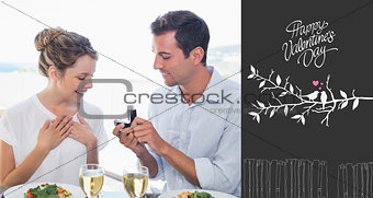 Composite image of man surprising woman with a wedding ring at lunch table