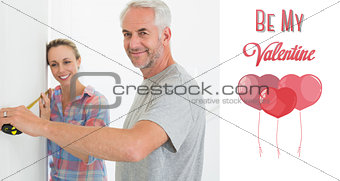 Composite image of happy couple making some measurements together