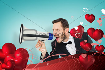 Composite image of geeky businessman shouting through megaphone