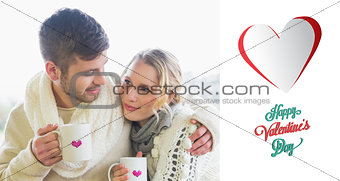 Composite image of loving couple in winter wear with coffee cups against window