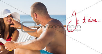 Composite image of handsome man applying sun cream on his girlfriends nose