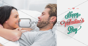 Composite image of cheerful couple awaking and looking at each other