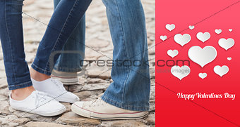 Composite image of couple in jeans standing on path