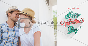 Composite image of young hip couple sitting on bench about to kiss