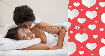 Composite image of couple lying in bed and cuddling
