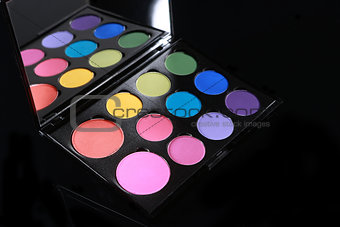 Colorful Palette of Various Eyeshadows on Black Background