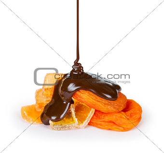 Feed chocolate pouring onto dried apricot and marmalade on white