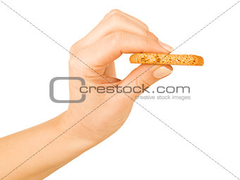 oatmeal cookies in hand on a white