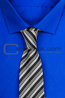 blue shirt with tie isolated on white