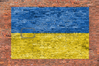 Flag of Ukraine painted over brick wall