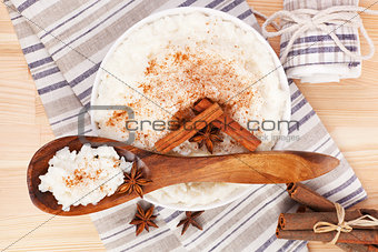 Rice pudding with wooden spoon.