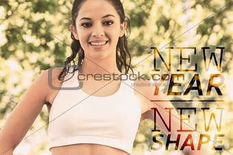 Composite image of active cheerful brunette standing hands on hips smiling