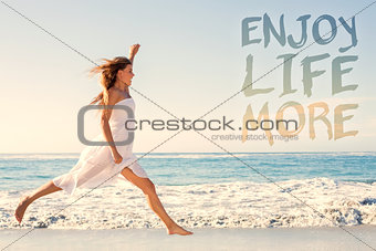 Composite image of beautiful blonde in white sundress jumping up on the beach