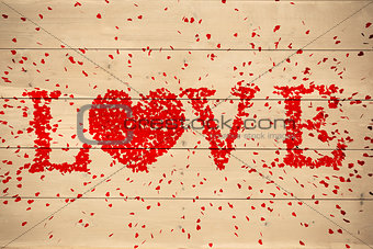 Composite image of love spelled out in petals