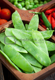 Fresh green peas, tomato and chili