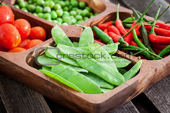 Fresh green peas, tomato and chili