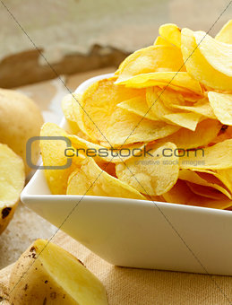 natural organic potato chips on a wooden table