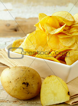 natural organic potato chips on a wooden table