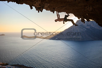 Male rock climber at sunset
