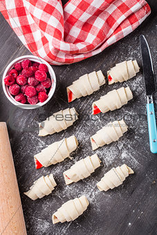Making croissants with raspberries
