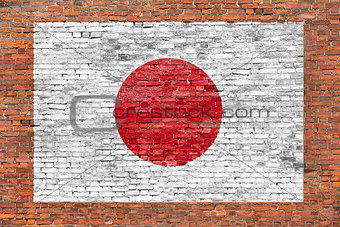 Flag of Japan painted over brick wall