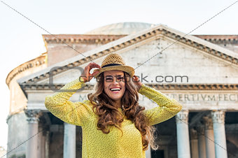 Portrait of happy young woman in front of pantheon in rome, ital