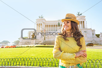 Portrait of happy young woman looking into distance on piazza ve