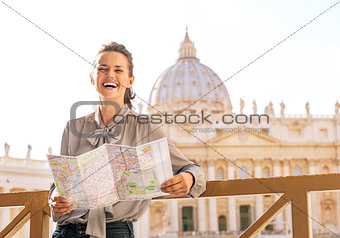 Happy young woman in front of basilica di san pietro in vatican 