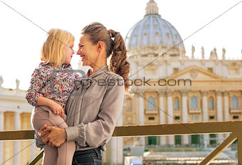 Portrait of happy mother and baby girl on piazza san pietro in v