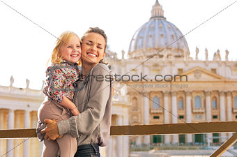 Portrait of happy mother and baby girl hugging on piazza san pie