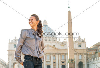 Happy young woman sightseeing on piazza san pietro in vatican ci