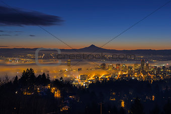 Fog Rolling in at Dawn over the cityscape of Portland