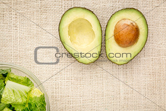 halved avocado and lettuce